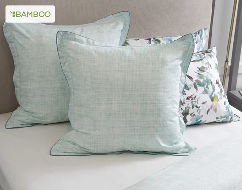 Two Seabreeze Euro Shams dressing a bed alongside the Seabreeze Pillow Shams.