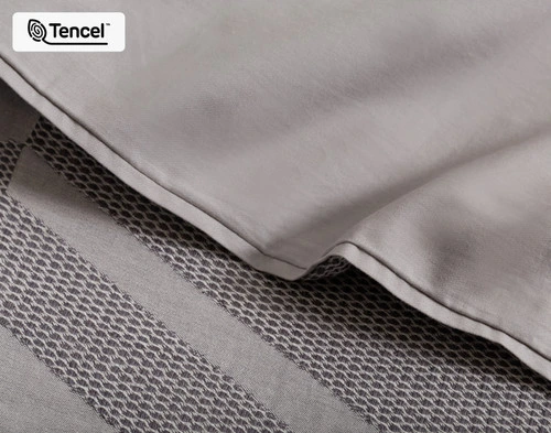 Close-up of the smooth percale backing and textural jacquard surface on our Mazama Duvet Cover.