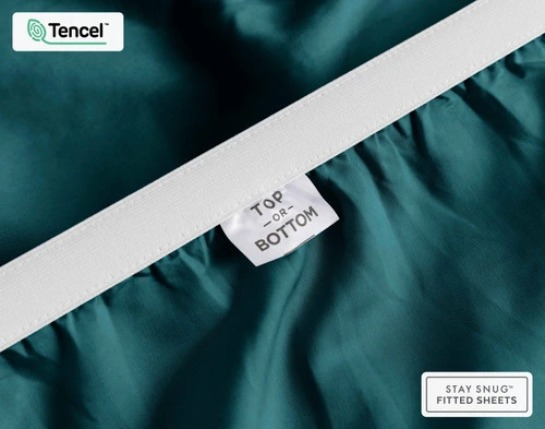 Close-up of Top & Bottom tag on the elastic of our BeechBliss TENCEL™ Modal Fitted Sheet in Jungle.