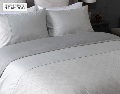 Closer view of our Marco Duvet Cover dressed neatly over a queen bed.