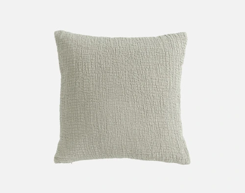 Front view of our Crinkle Square Cushion Cover in Sage sitting in front of a solid white backdrop.