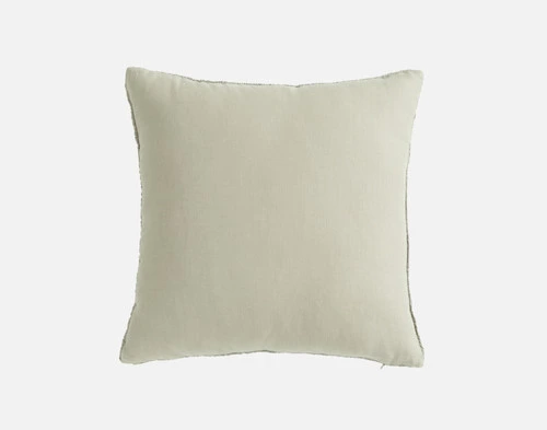 Back view of our Crinkle Square Cushion Cover in Sage sitting in front of a solid white backdrop.