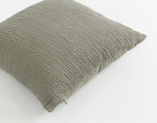 Top angled view of our Crinkle Square Cushion Cover in Sage showing its front side.