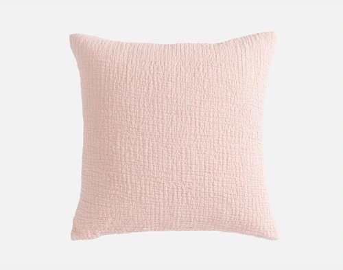 Front view of our Crinkle Square Cushion Cover in Peony sitting in front of a solid white backdrop.