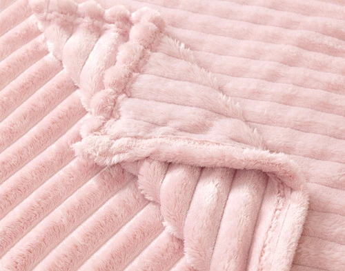 Folded corner of our Primrose Ribbed Plush Blanket.