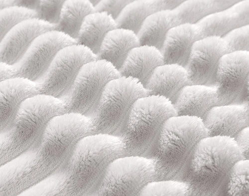 Close-up on the textural ribbed lines on our Silverado Ribbed Plush Blanket.