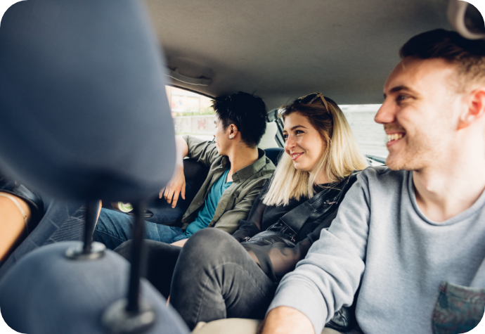 Group of friends driving around in a car.