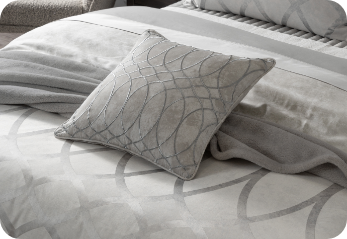 Our Metropolitan Square Cushion Cover dressing the head of a bed with the rest of the collection.