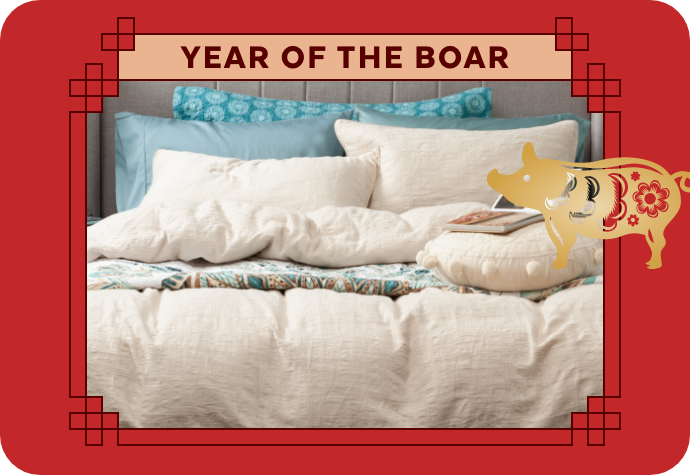A graphic representing the Year of the Boar, showing our Stonehaven Duvet Cover with a red border.