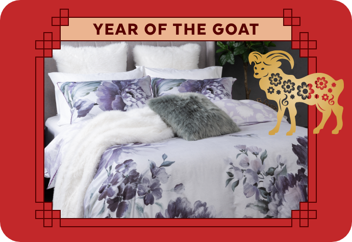 A graphic representing the Year of the Goat, showing our Divine Duvet Cover with a red border.