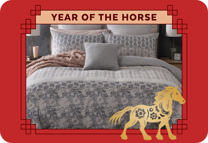 A graphic representing the Year of the Horse, showing our Raina Duvet Cover with a red border.