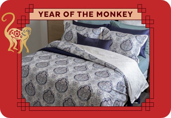 A graphic representing the Year of the Monkey, showing our Dover Duvet Cover with a red border.