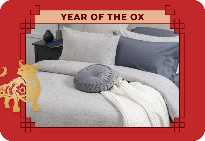 A graphic representing the Year of the Ox, showing our Landon Duvet Cover with a red border.