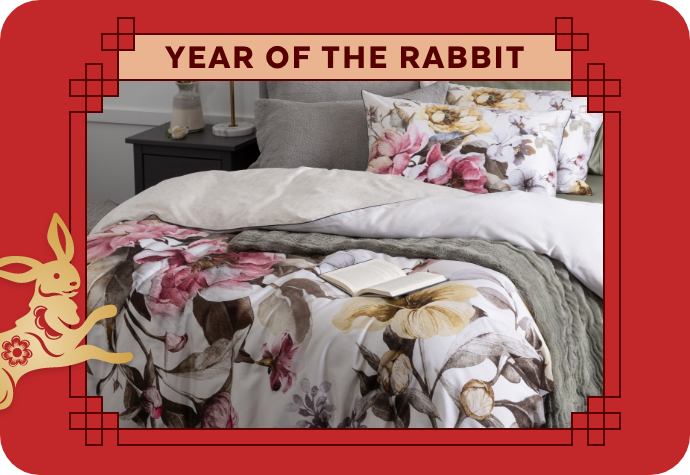 A graphic representing the Year of the Rabbit, showing our Braganza Duvet Cover with a red border.